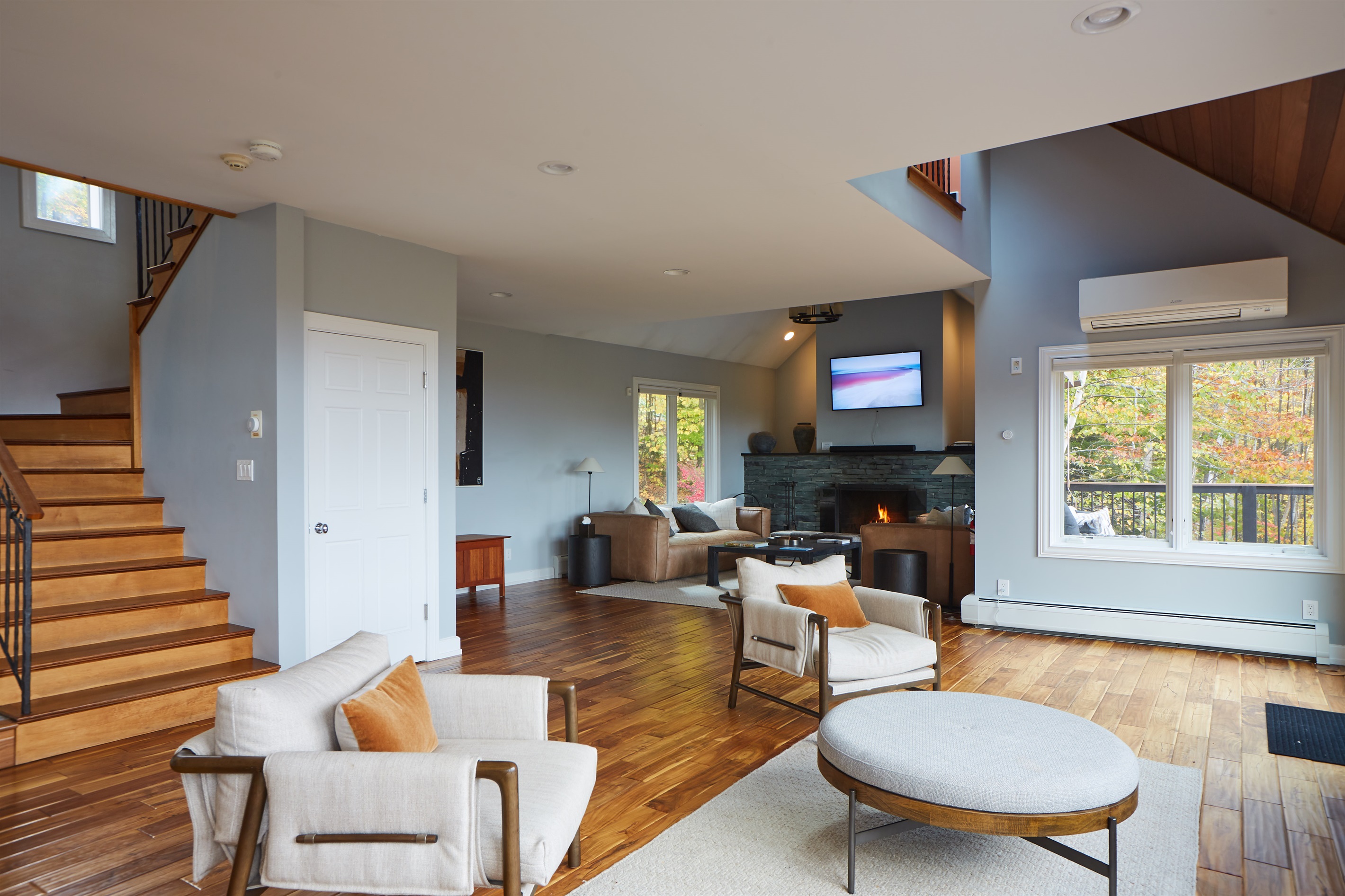 Relax in the stylish lounge area, featuring plush seating and seamless flow to the rest of the home.