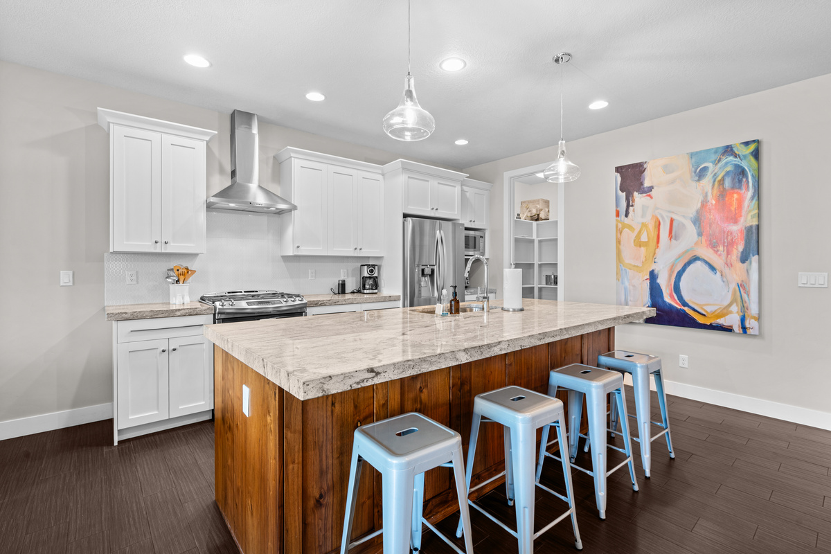 Gather around the oversized island for meals, coffee, and conversation.