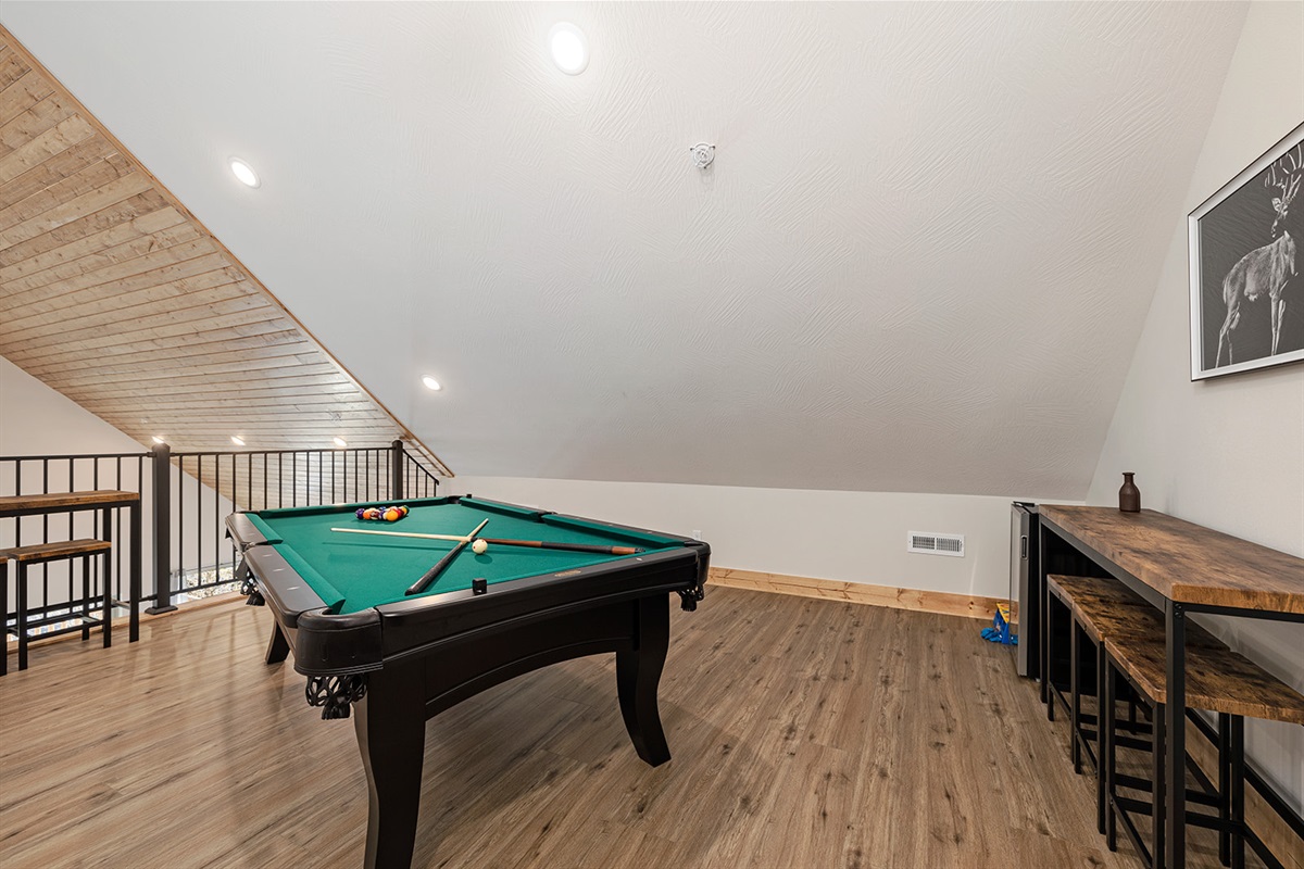 Extra seating around the pool table for the whole family to compete!