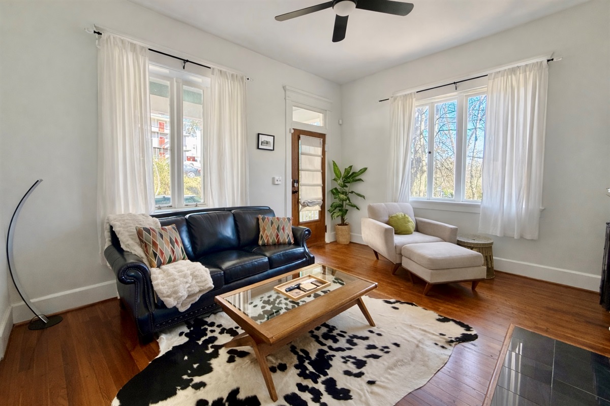 Experience our living room adorned with unique artwork, where creativity meets comfort.