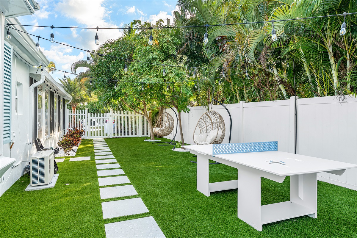 Fun and Games! Spend time outdoors with our provided outdoor game table and the beautifully maintained turf yard, perfect for kids and adults.