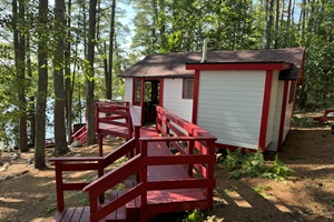 erial point of view of the main entrance , and the screened porch with a indoor living