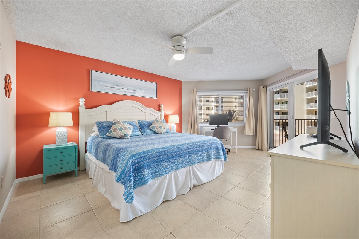 King size master bedroom with pool/gulf views and patio access.