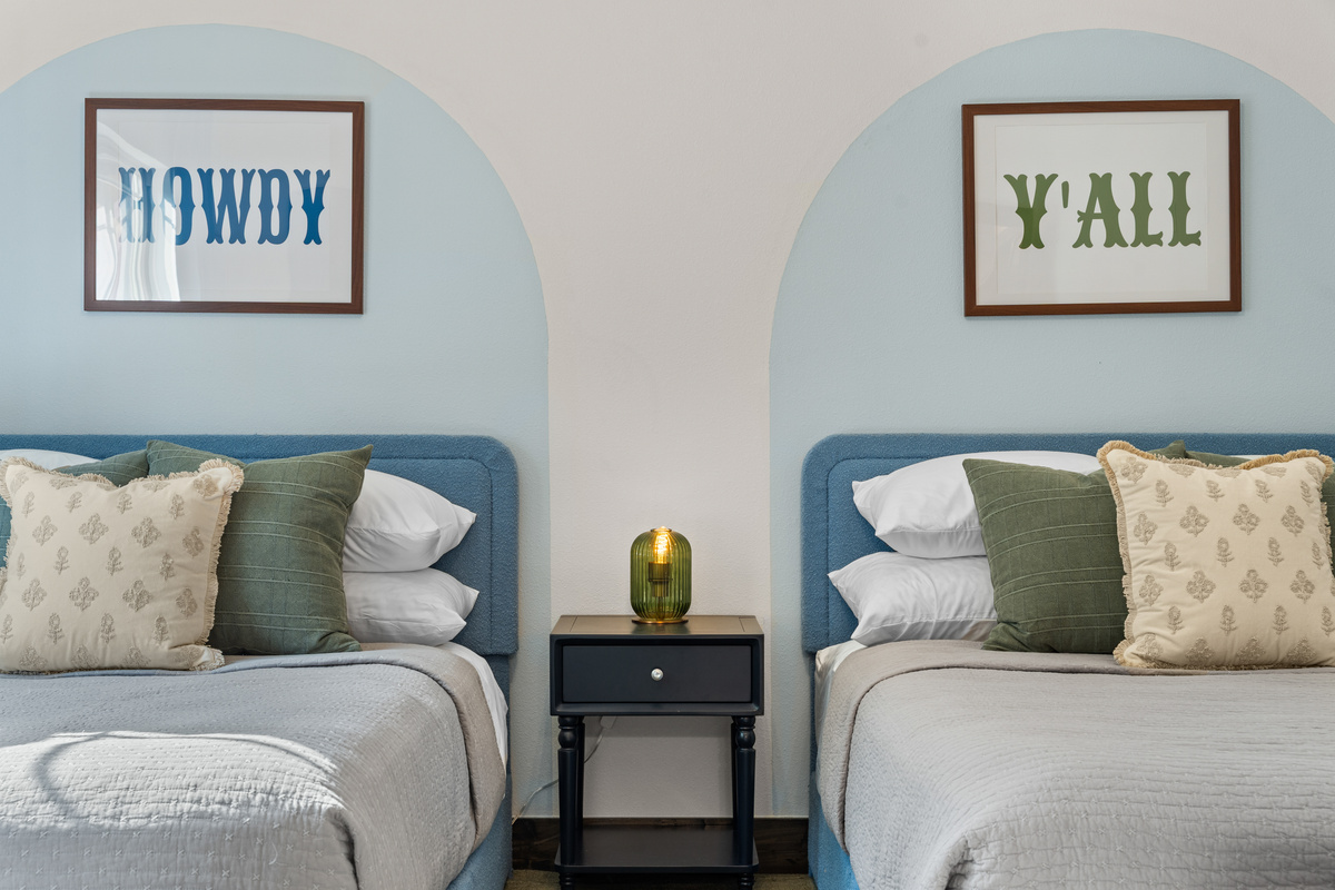 In the main level Austin room, two full beds, two Texas greetings, 'Howdy' and 'Y'all', for an easy night's sleep.