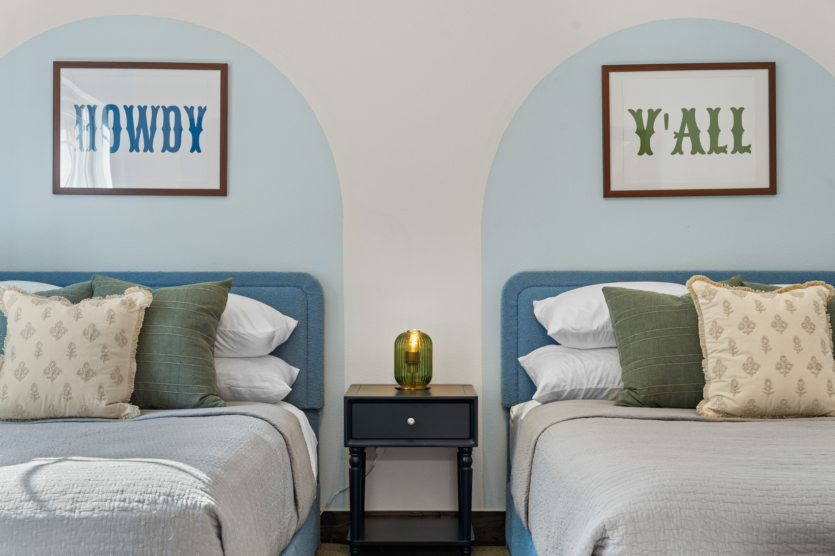 In the main level Austin room, two full beds, two Texas greetings, 'Howdy' and 'Y'all', for an easy night's sleep.