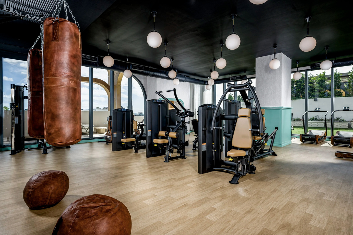 A state-of-the-art fitness center with strength, cardio and boxing - a full wellness floor at home.