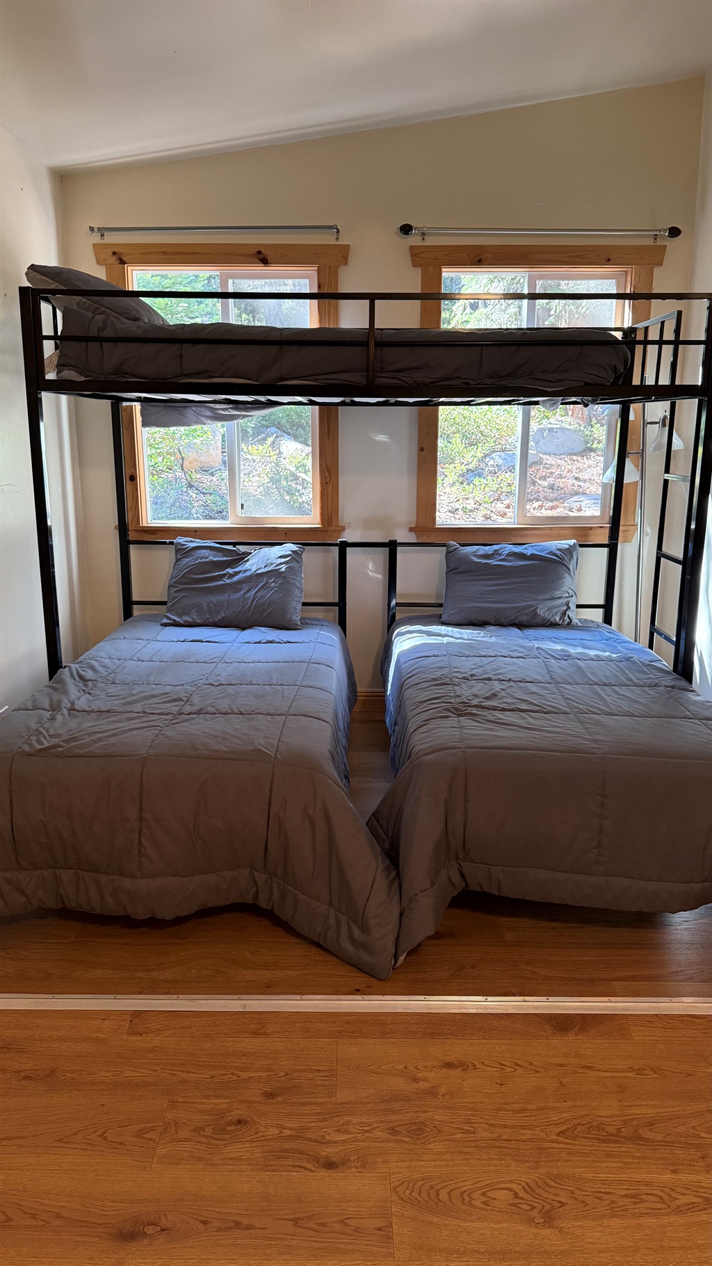 Flexible sleeping arrangement with two lower twin beds and an upper bunk, designed to accommodate different needs while maintaining comfort and functionality.