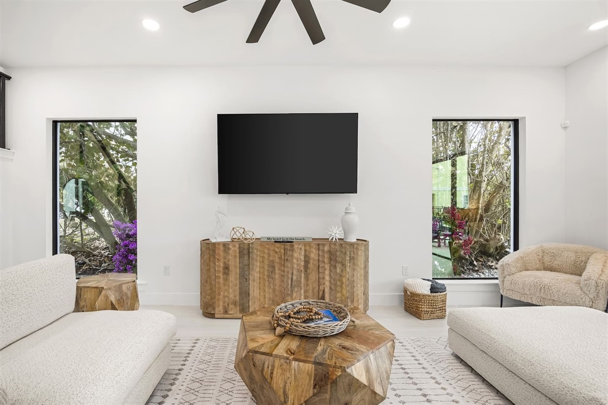 Living room featuring a TV, perfect for cozy movie nights or entertainment.