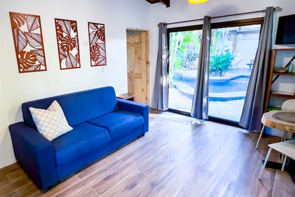 Full-size sleeper sofa can make this area a second bedroom.  