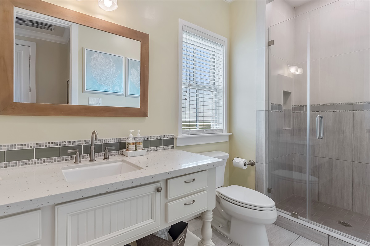 Full Bathroom #1: Guest bathroom with glass shower enclosure.