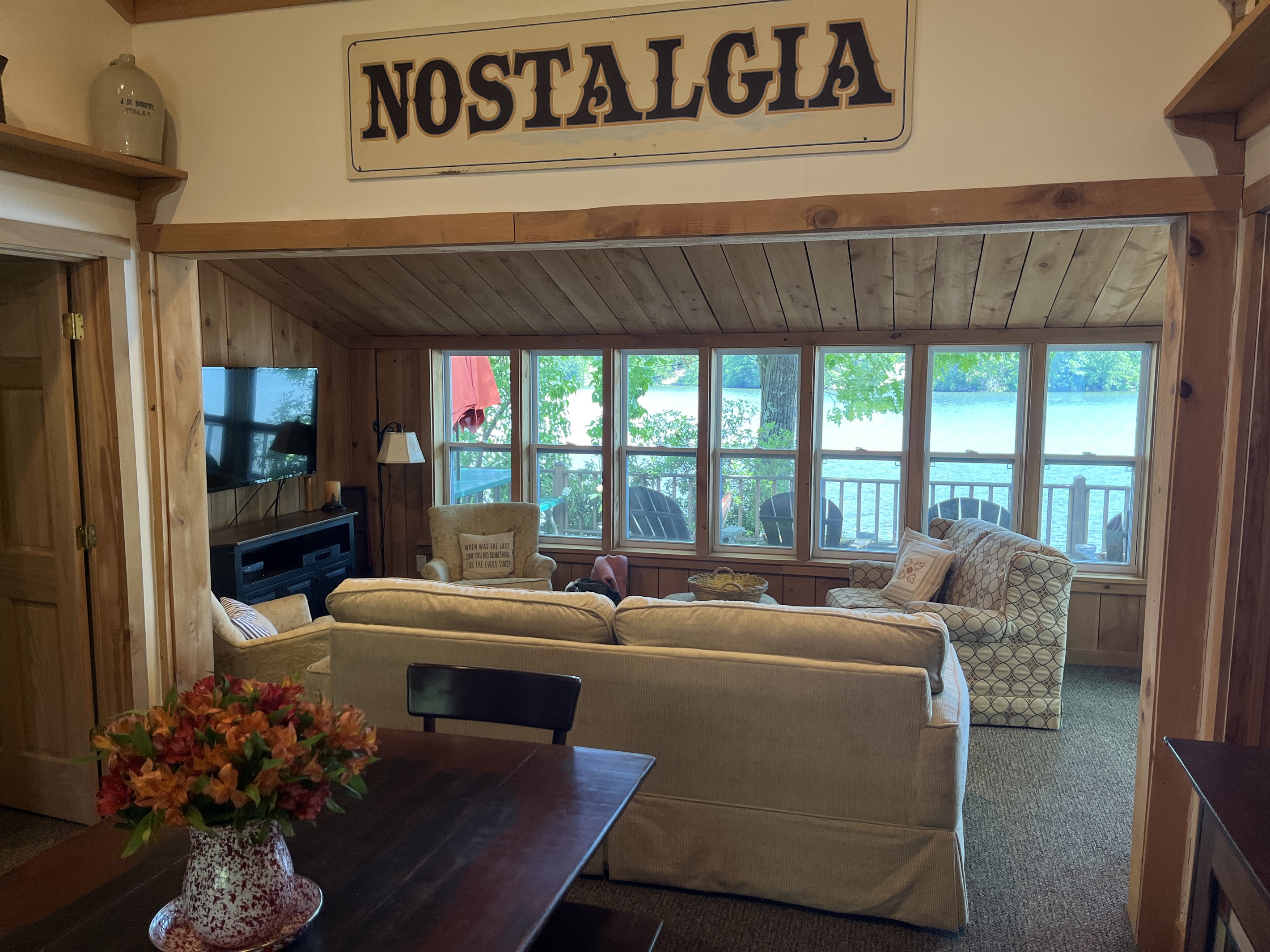 Dining area and living room overlooking the water