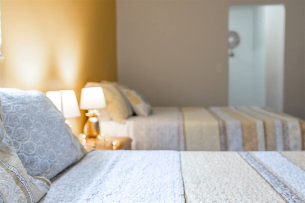 Guest Room with 2-queen beds. Pineapple themed room. 