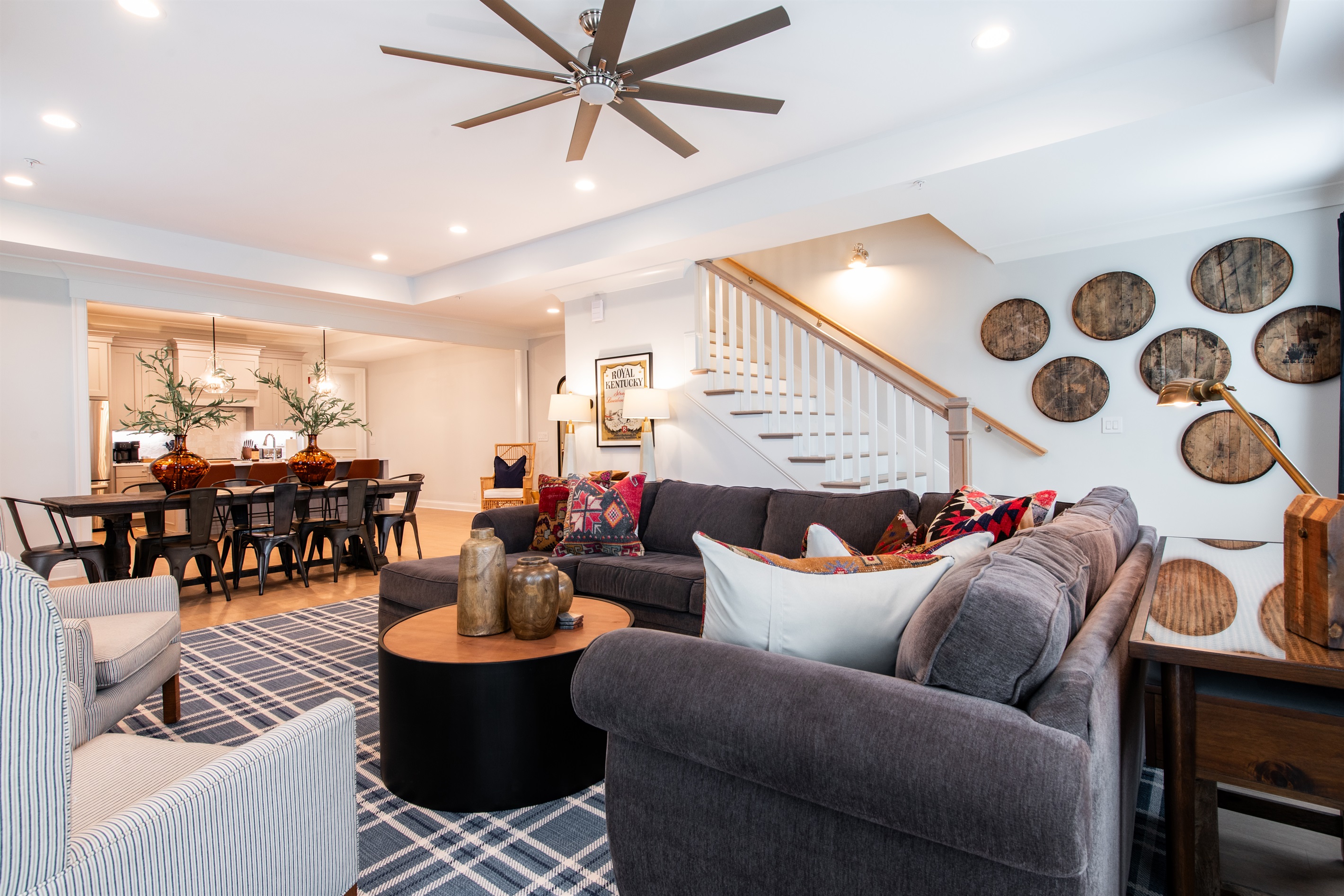 Experience Kentucky's bourbon culture in this chic living space. Featuring a cozy sectional, bourbon barrel decor, and an open dining area, it's perfect for relaxing after a day exploring the Bourbon Trail.