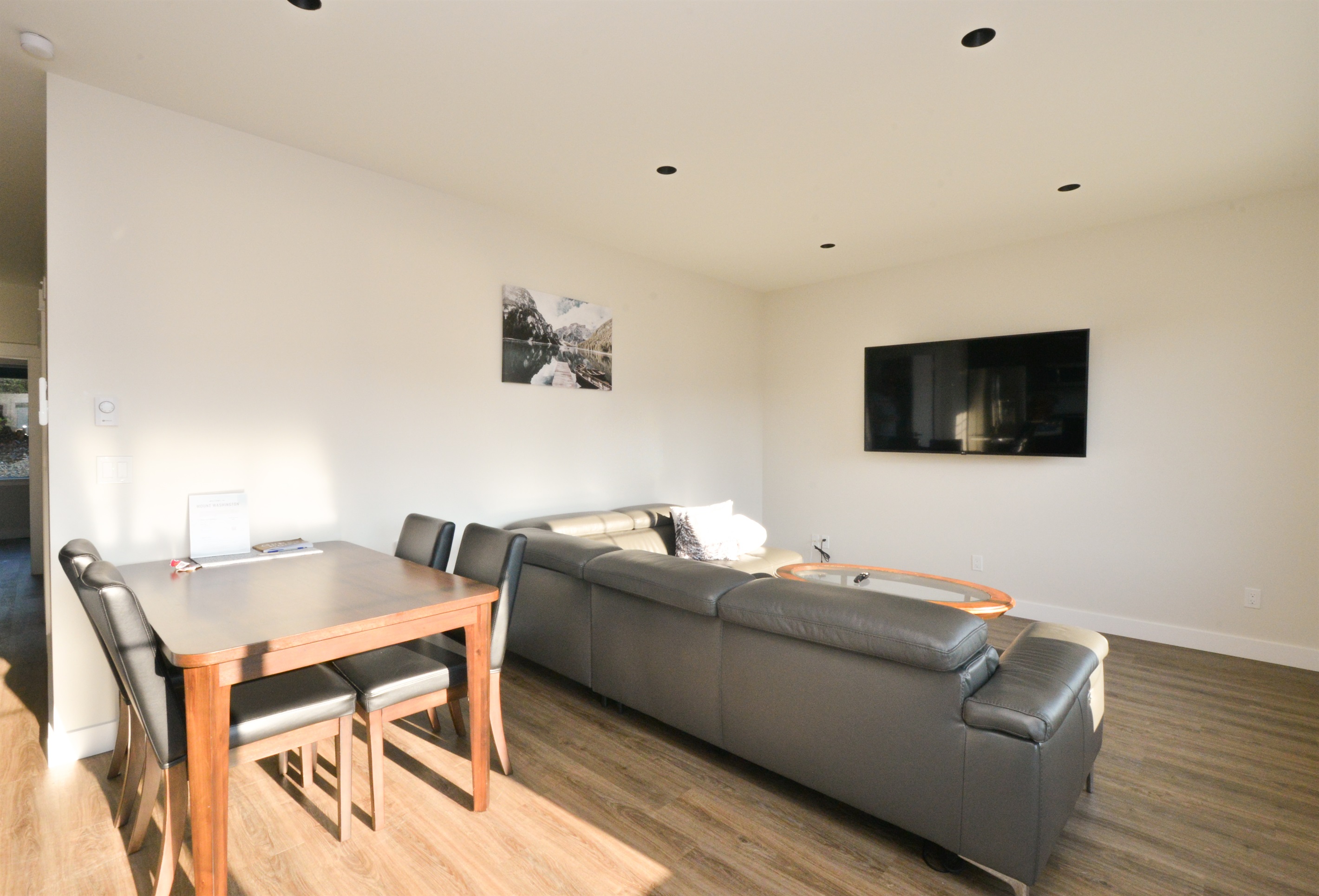 Relax after the mountain in this open-concept 2nd floor lounge with large sectional and smart TV