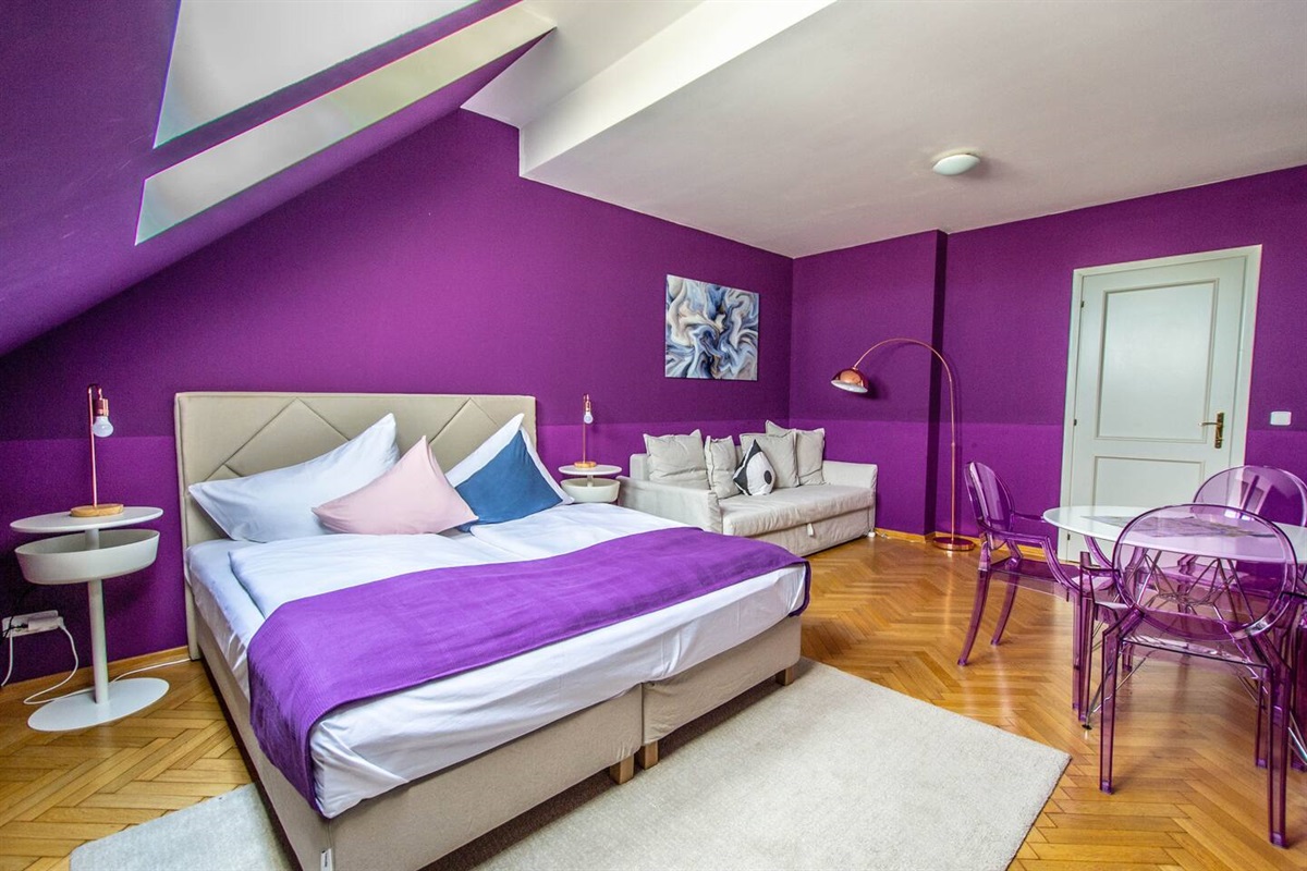 Spacious bedroom in romantic colours. Total area of apartment is 75 m2.