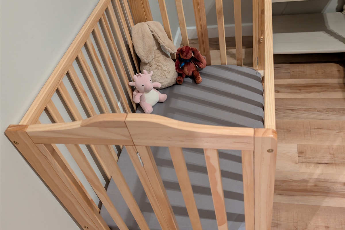 Safe and cozy crib provided for peaceful nap times for baby.