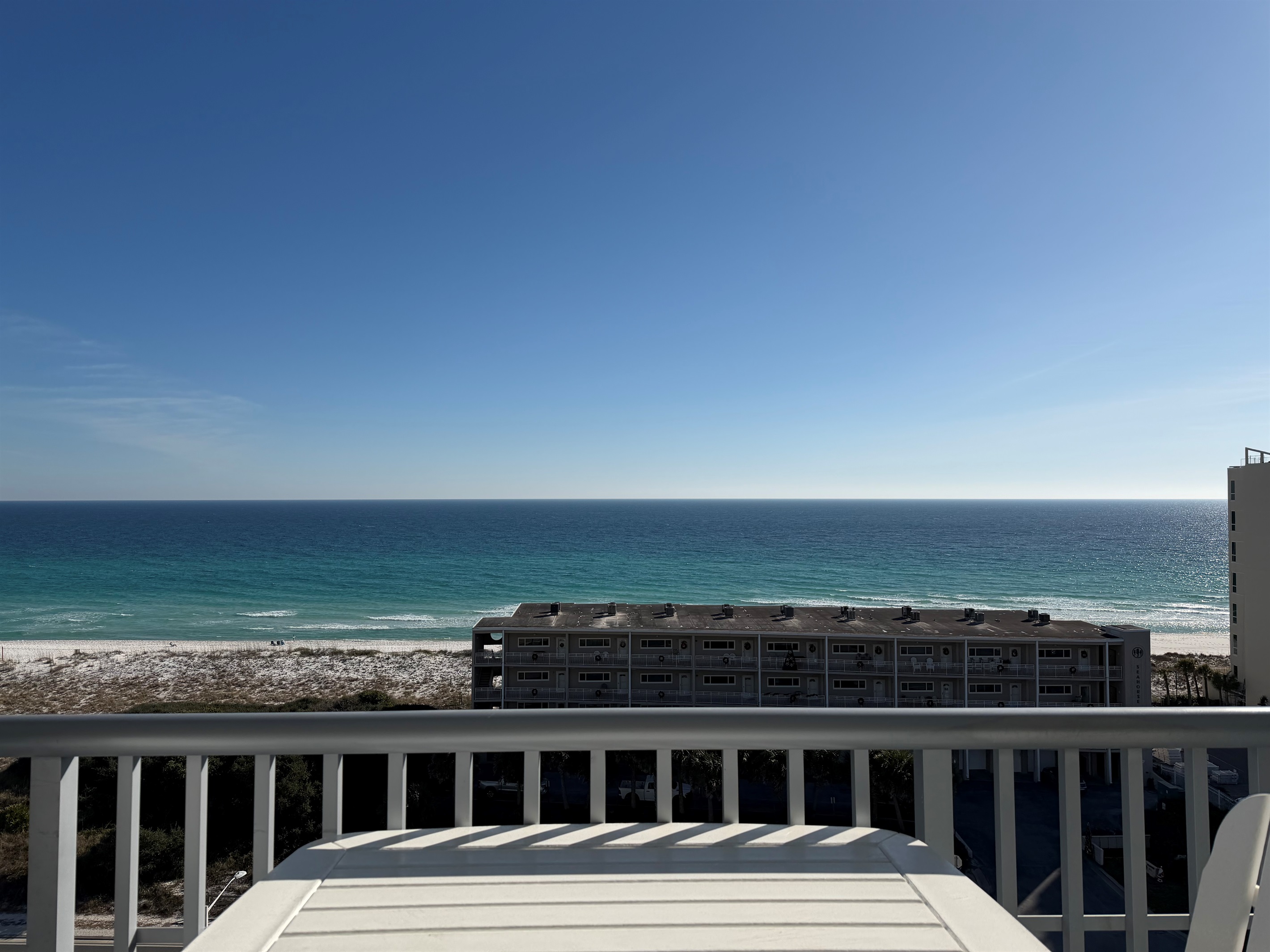 View straight on from balcony, seated at table.