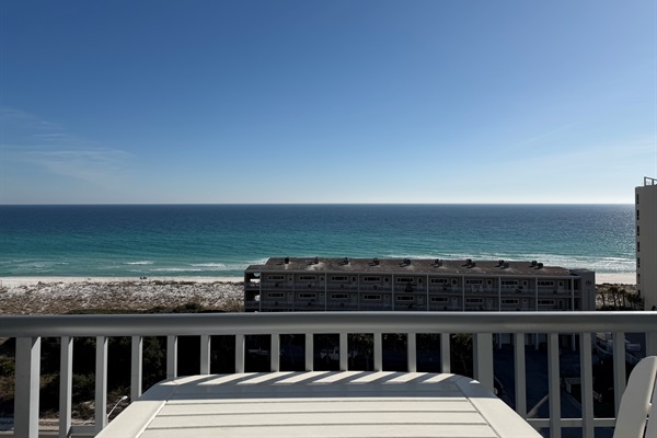 View straight on from balcony, seated at table.