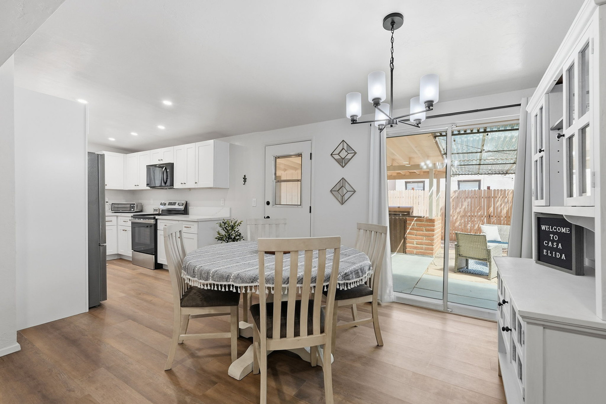Versatile Dining Table: Comfortably seats 4 and doubles as a spacious laptop-friendly workspace. *Note - the sliding glass doors do NOT open - serve as windows only (use the door).