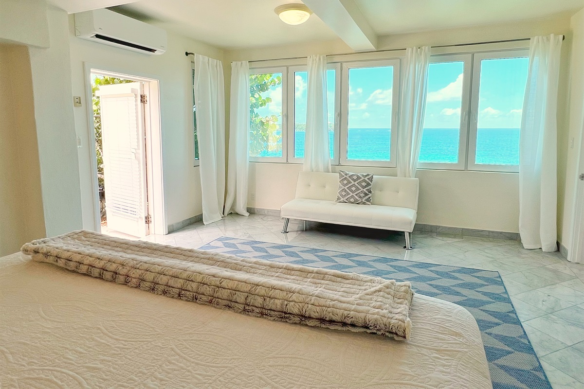 Bedroom offers ample space and natural light for guests.