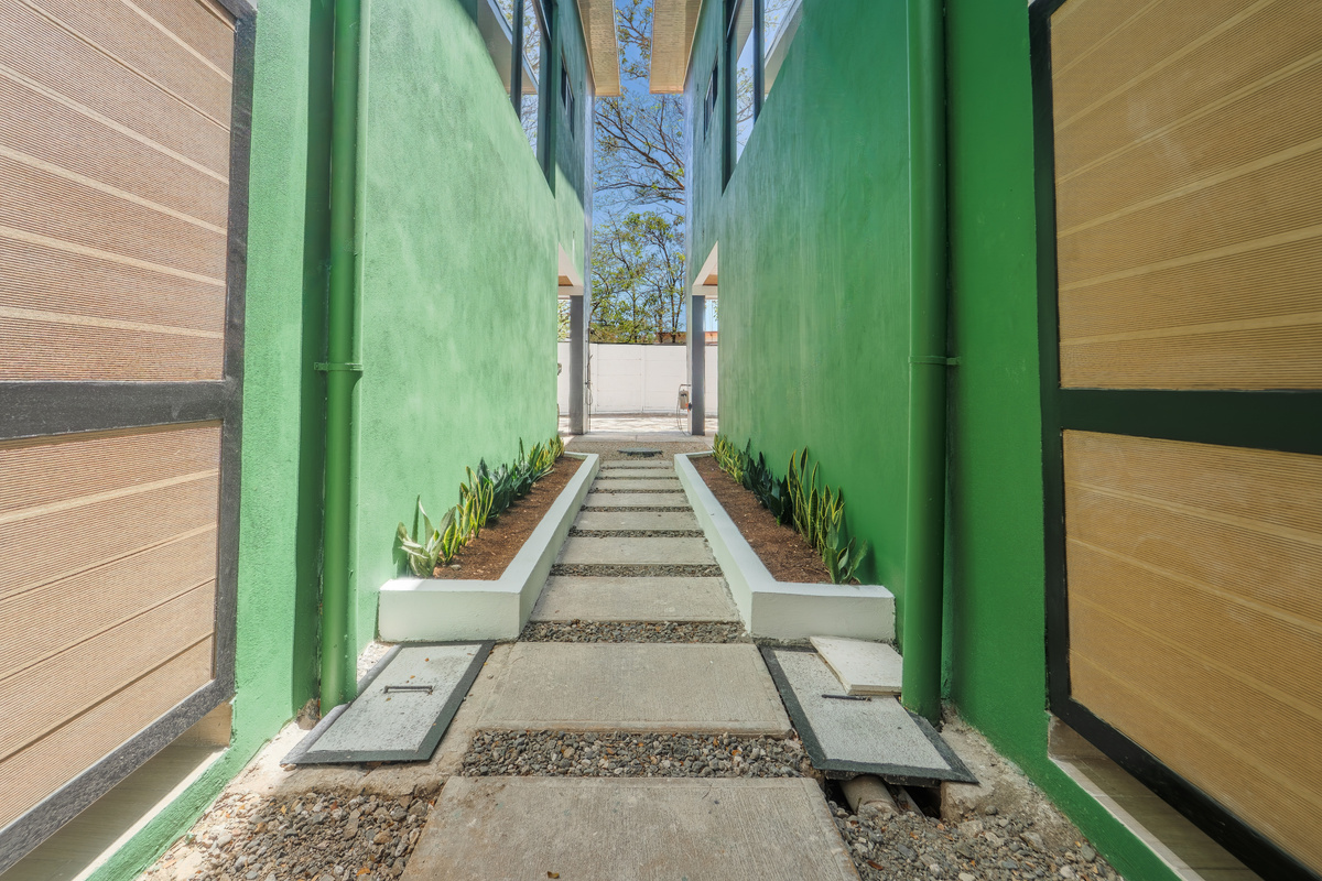 The path between the two villas. Close enough to connect, private enough to feel separate.
