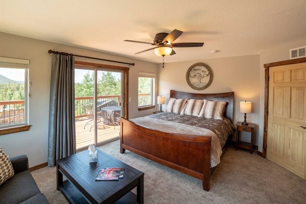 Upstairs Bedroom 2 with luxurious king bed with amazing picture window views. Enjoys direct access to the deck.