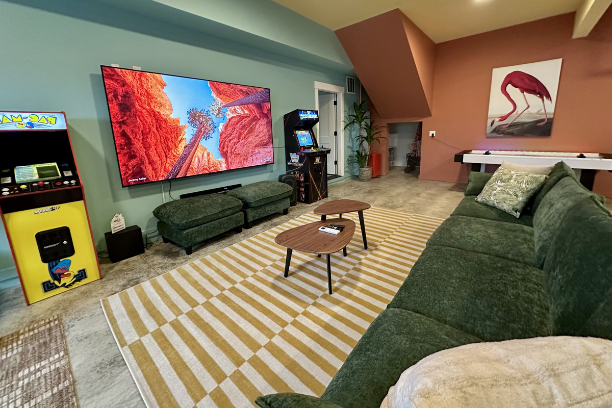Every seat downstairs has a view of the big screen, with the arcade cabinets just a few steps away.