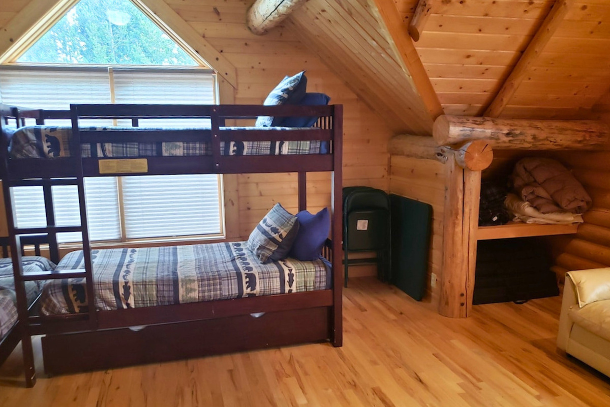 Extra blankets and storage in the bunk room.