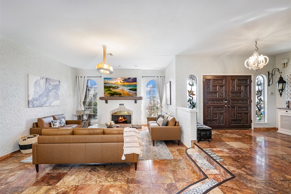 Step down into this well appointed living room for family or group gatherings. 