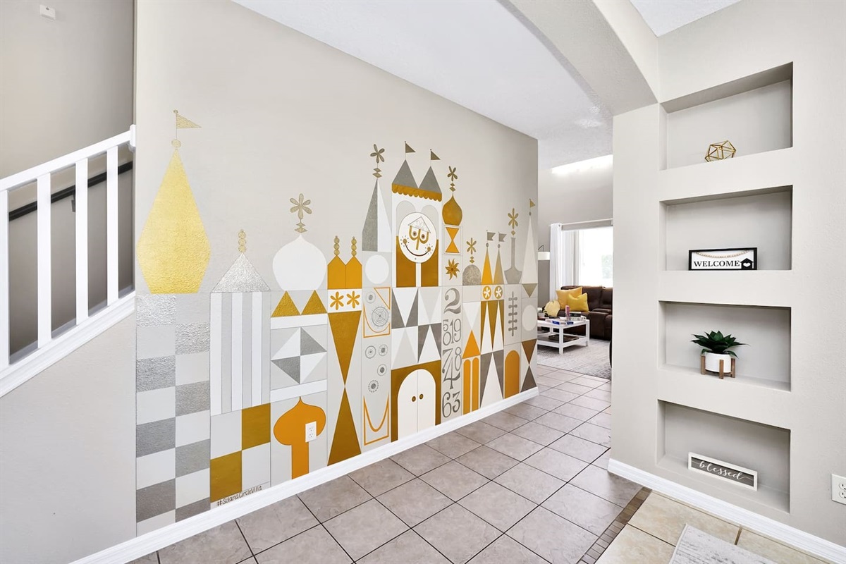 Hand painted by the host! Wall mural inspired by the classic "It's a Small World" Disney attraction!