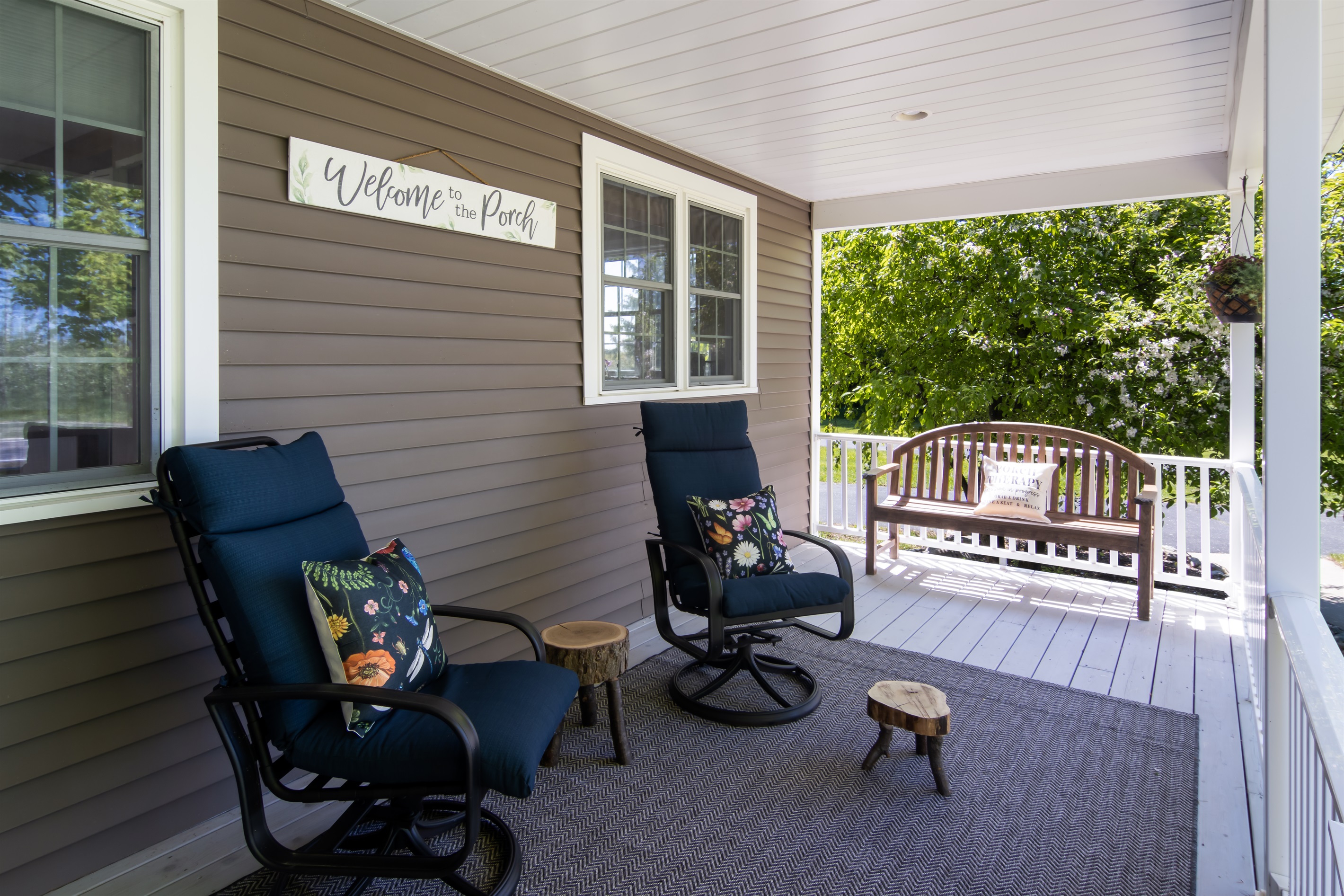 Relaxing front porch with rocking chairs and country charm.
