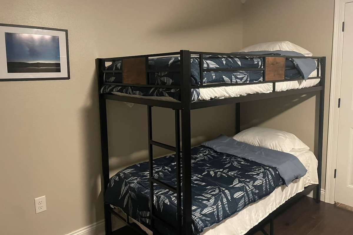 Bedroom with queen and twin bunks.