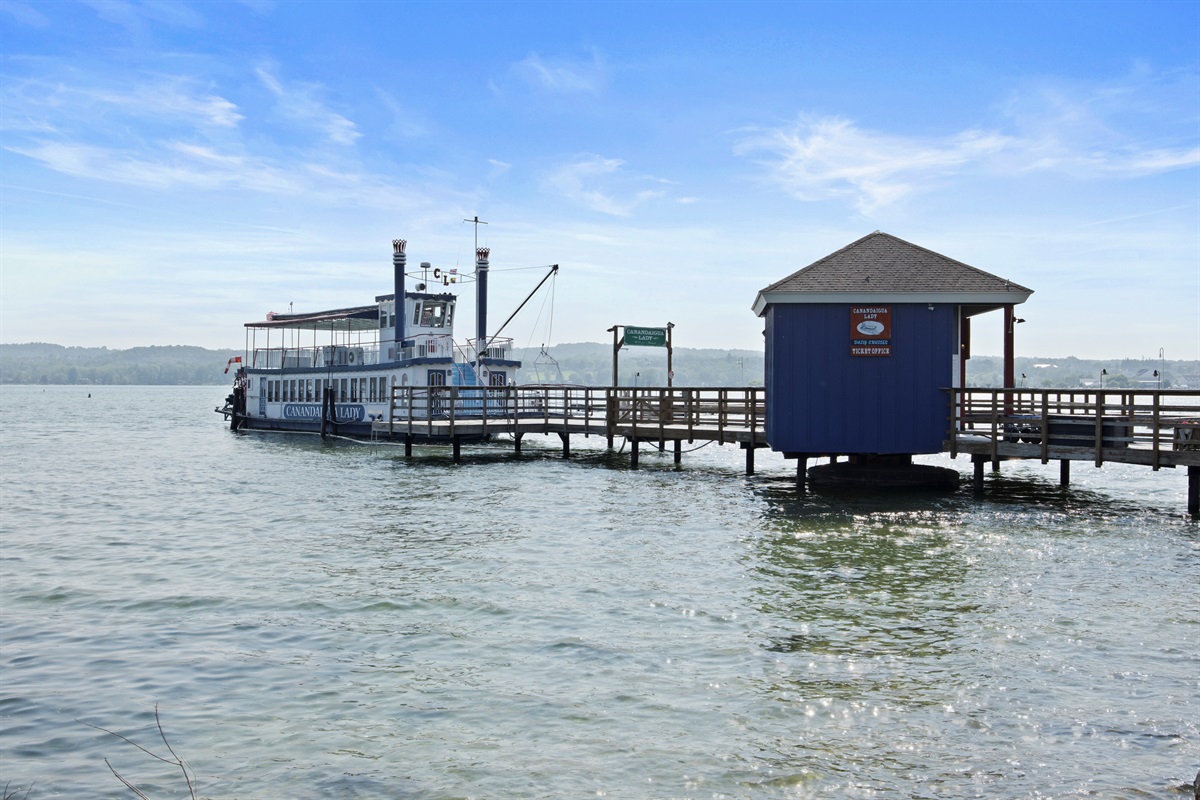 Start your lake adventure at the charming blue dock—home to the Canandaigua Lady