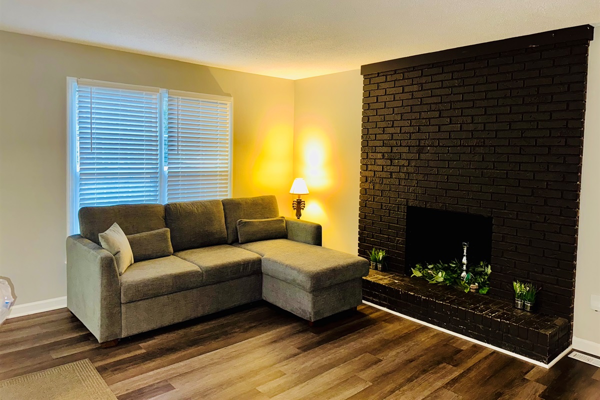  Living room with 55 in Smart TV and desk area. 