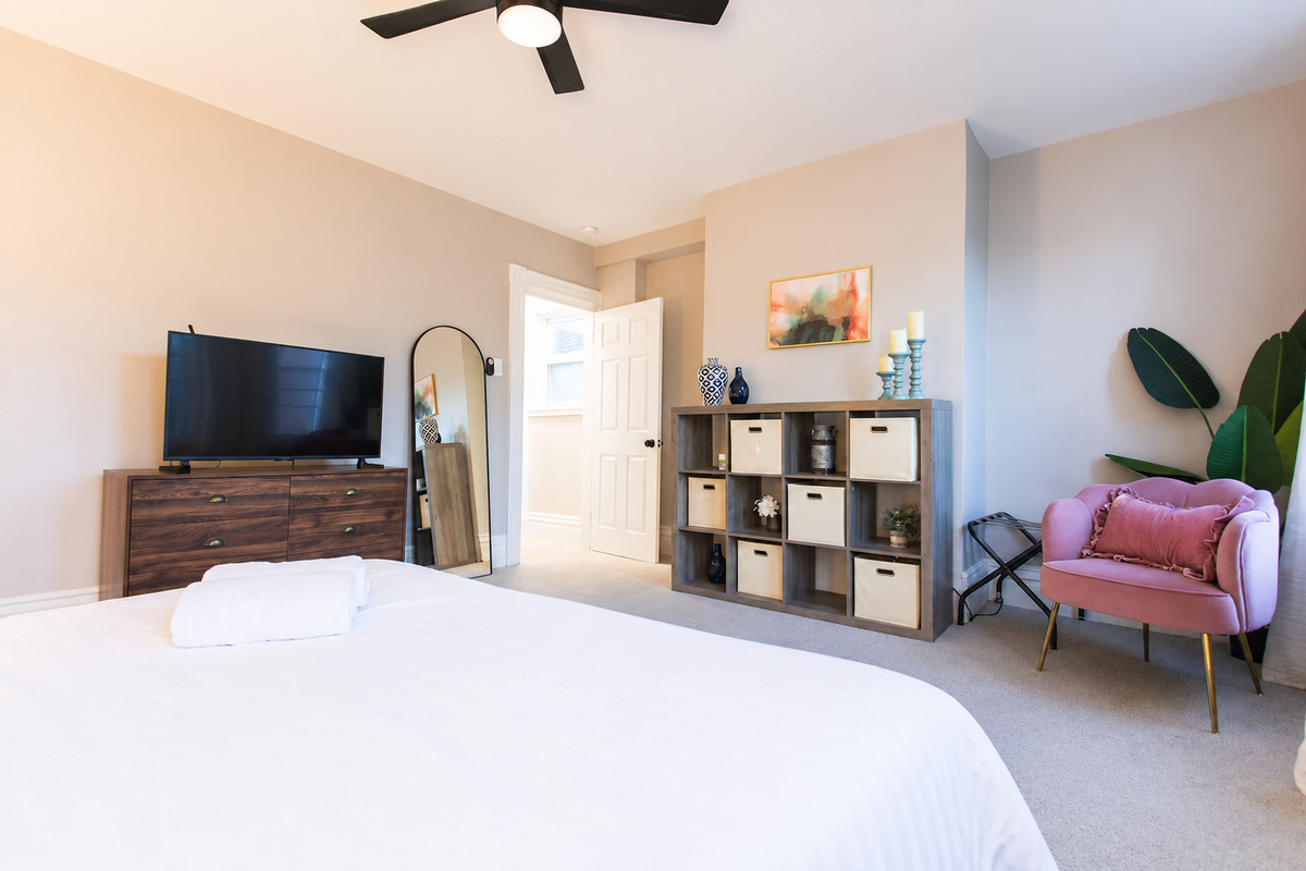 In the King Bedroom, store your belongings in the dresser and cubbies with baskets in the cube storage unit.