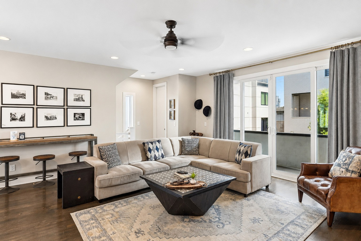 Sink into the tan sectional and let the group decompress &mdash; the main living area gives everyone room to spread out without anyone bumping elbows