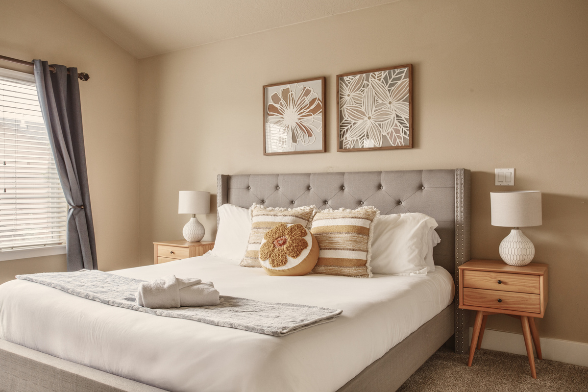 Primary bedroom with a king bed and a comfortable medium-feel mattress. Comfortable bedding with Oeko-Tex certified linens for a clean, restful sleep.