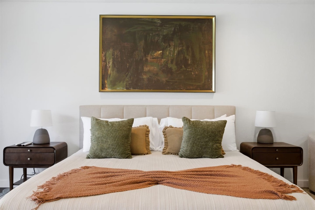 Primary king suite styled with fresh towels neatly arranged on the bed, adding a welcoming, hotel-style touch to your stay.
