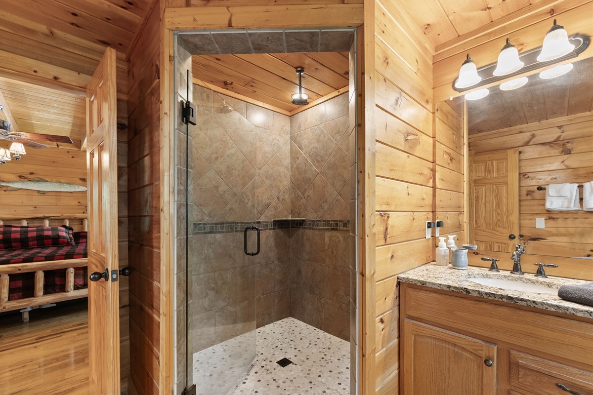 Luxurious ensuite bathroom featuring a relaxing jacuzzi tub and spacious walk-in shower for a true spa-like retreat.