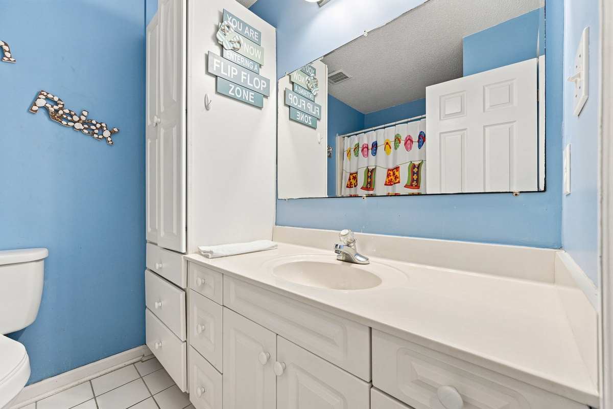 Convenient full hallway bathroom with a large vanity and plenty of storage for your essentials