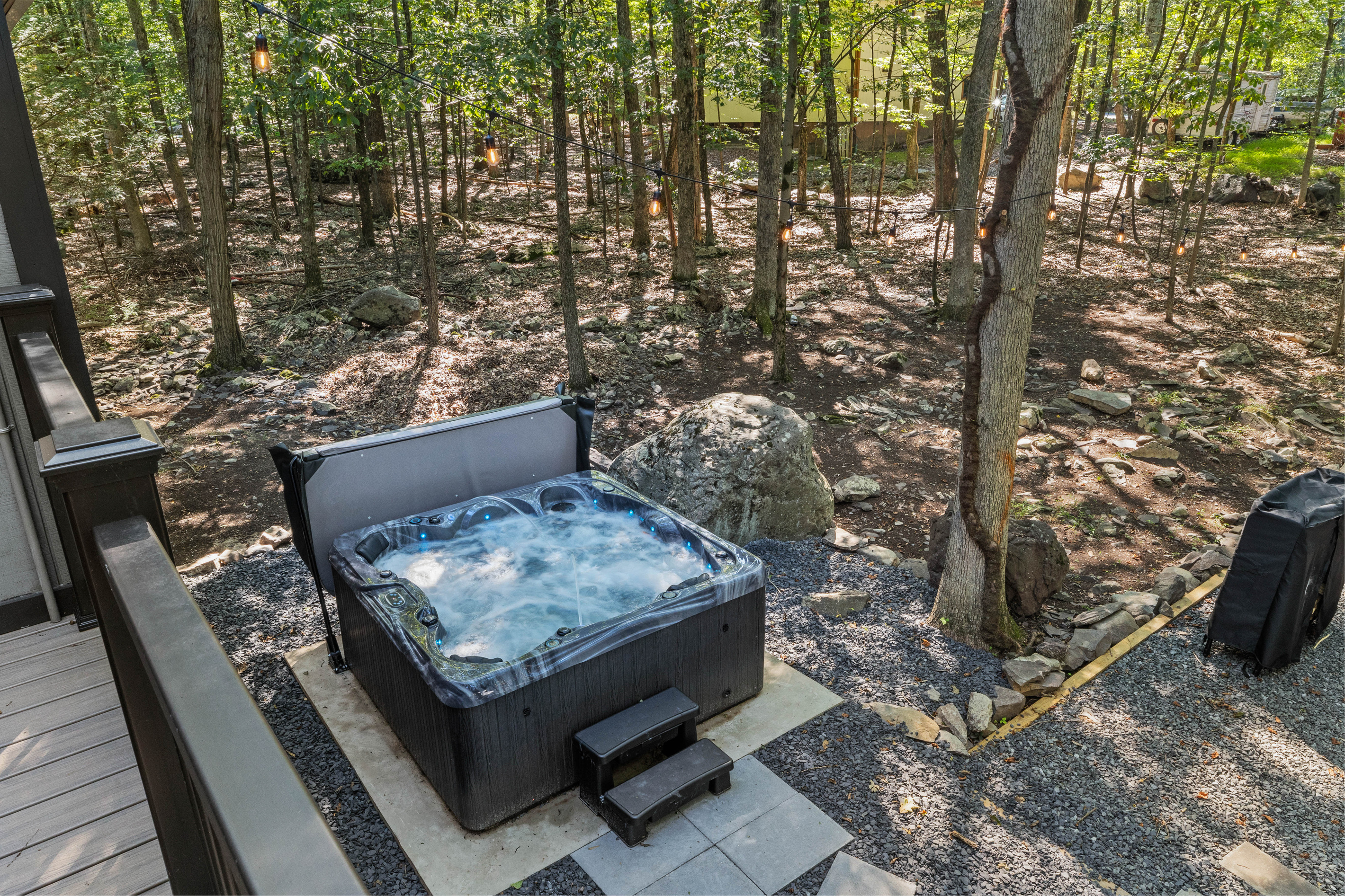 A premium, multi-person hot tub tucked for all-weather soaking and ultimate relaxation