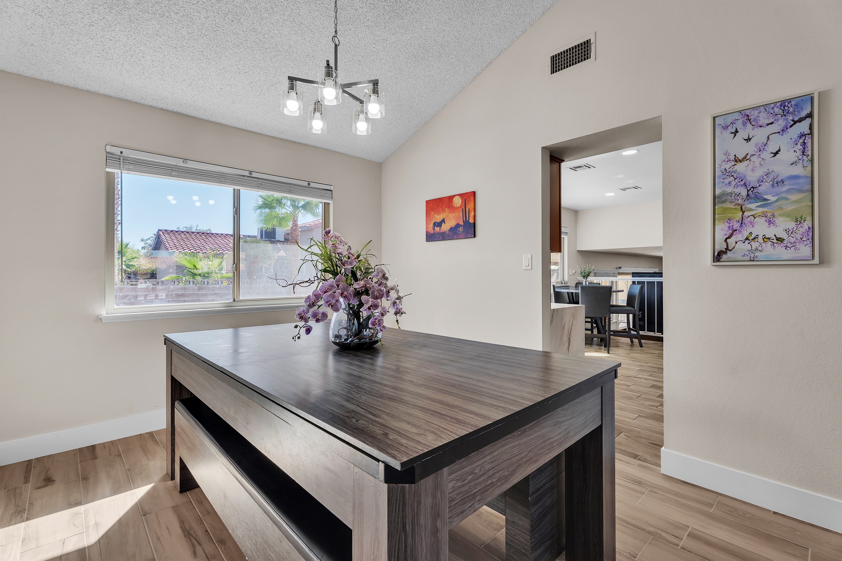 Dining room with large dining table that converts to pool table and ping pong table