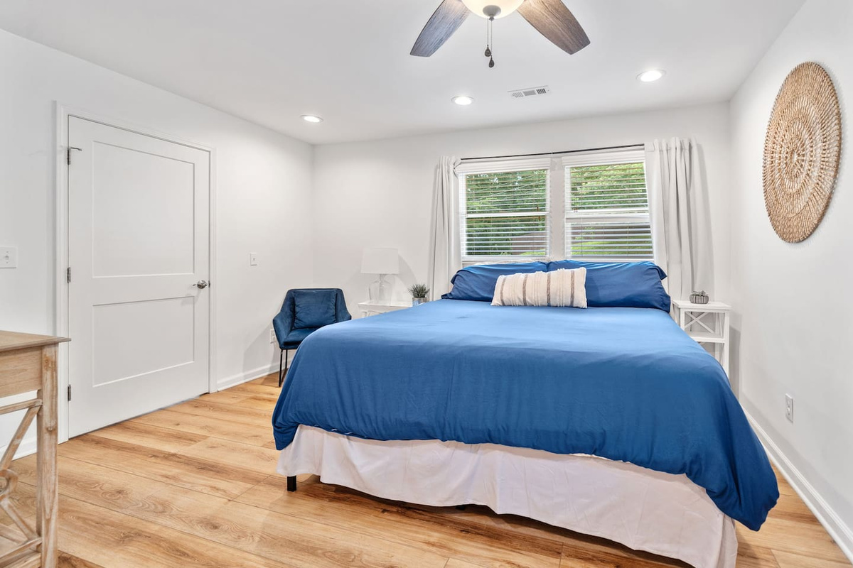 Primary Bedroom with King Bed and connected bathroom with walk-in shower.