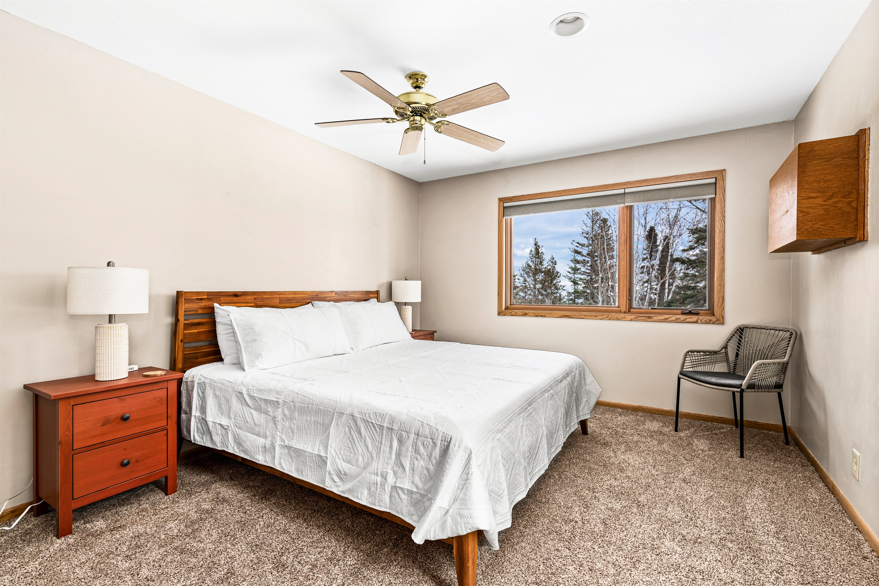 Welcoming second basement bedroom with a king bed, USB chargers conveniently placed on the nightstands, and a Nest thermostat to ensure personalized comfort. A peaceful retreat designed for relaxation