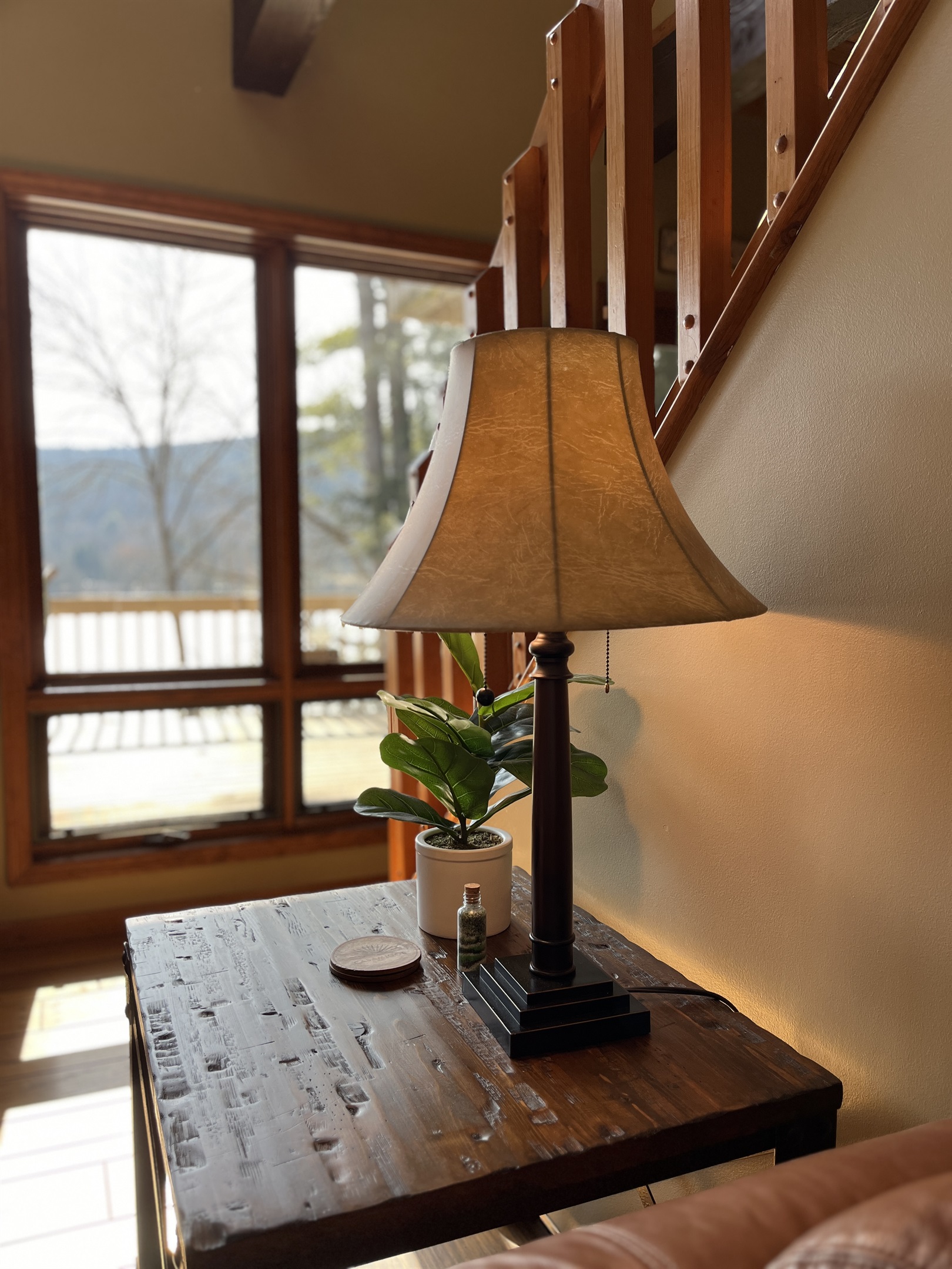 Camp Havon living room details with the deck and water view in the background.