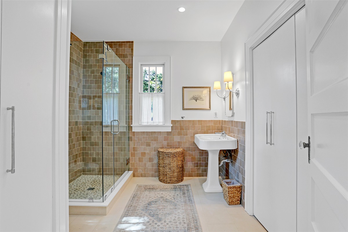 This ensuite blends classic style with modern amenities for your comfort and convenience.