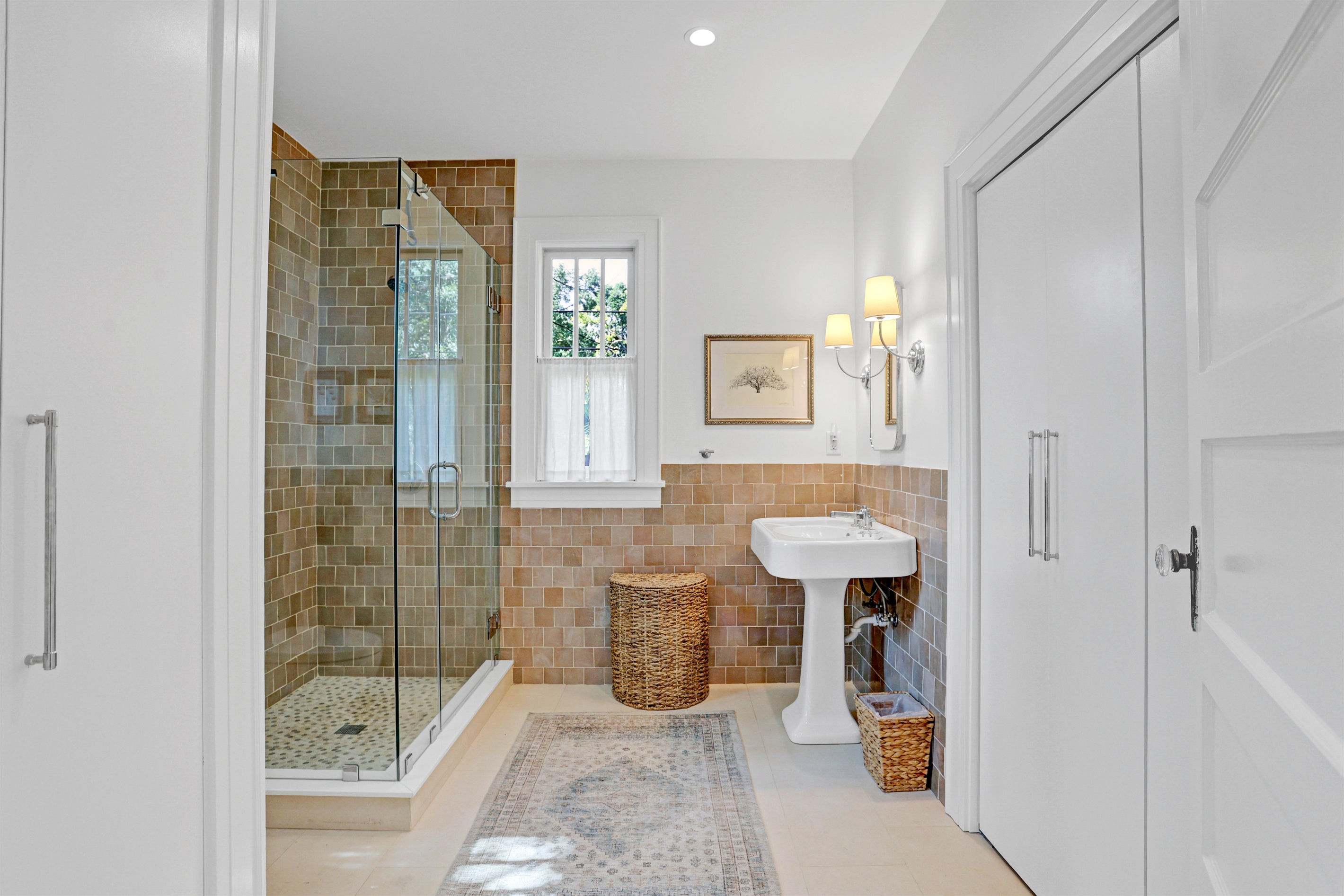 This ensuite blends classic style with modern amenities for your comfort and convenience.
