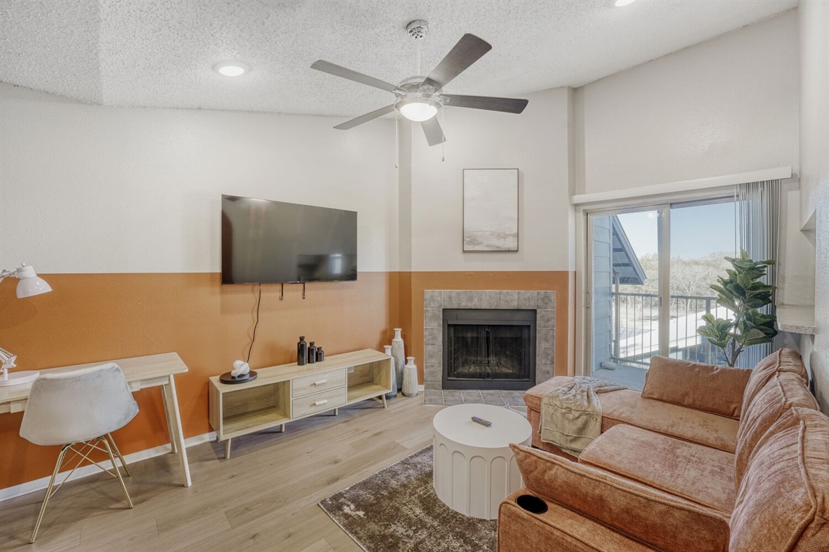 Modern warmth meets cozy comfort in this inviting living space.
