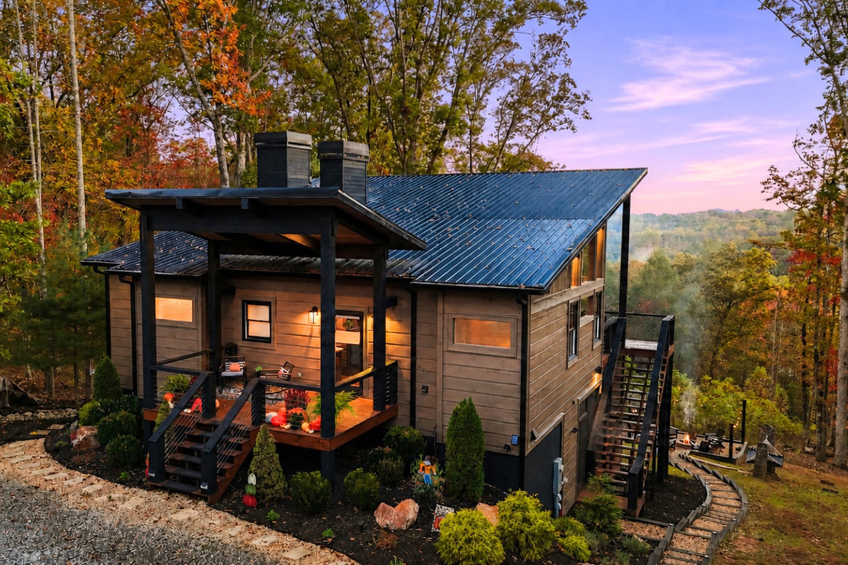 Rocking chairs, tall trees, and timeless tranquility at the front porch. A peaceful atmosphere.
