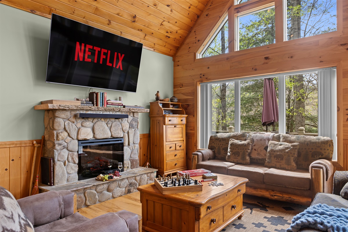 Living Area: Gather around the stone fireplace for game nights or movie marathons!